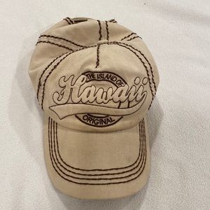 Cap with Hawaii stitched. Like new. Velcro for sizing. Beige and brown